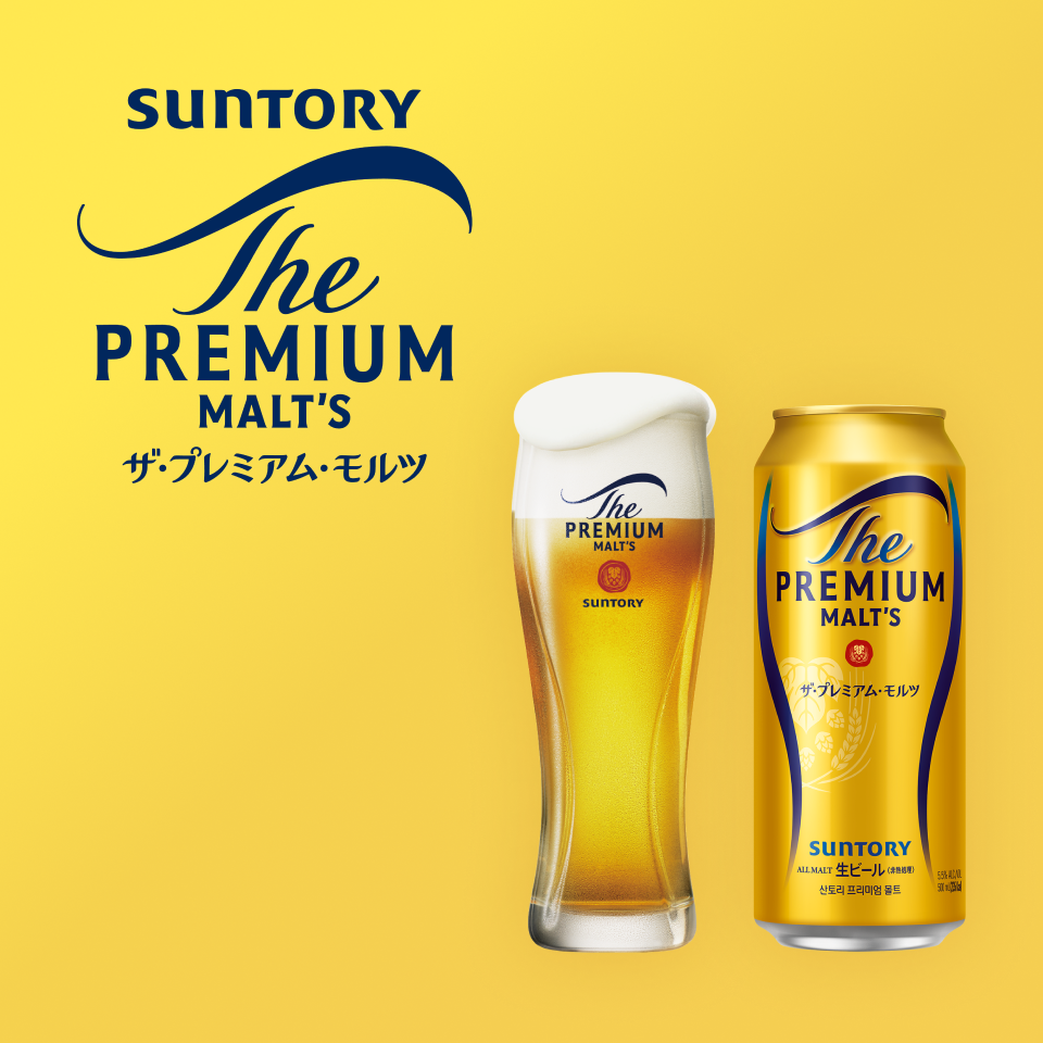 산토리 더 프리미엄 브랜드 로고와 골드,네이버 컬러에 500ml 캔맥주와 생맥주가 표기되어 있습니다.